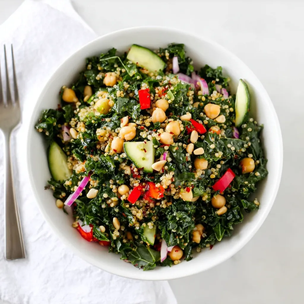 Elevate your lunch game with this vibrant and nutritious kale quinoa salad! Packed with fresh ingredients and bursting with flavor, it's the perfect healthy meal. Who's ready for a delicious and easy plant-based dish?